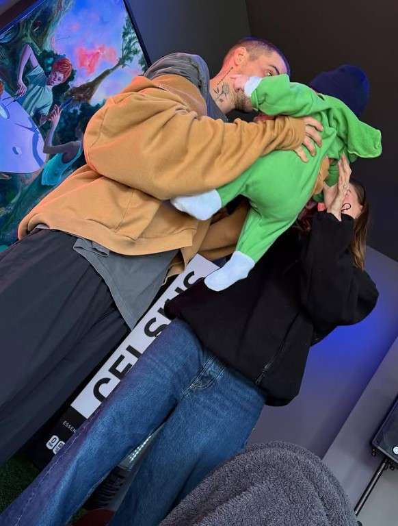 justin and hailey holding baby jack